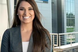 Sales manager for CertainTeed poses in front of the office building