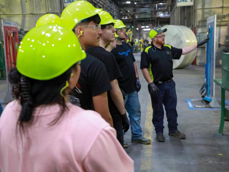 Students gain firsthand knowledge on the roofing plant  floor during SFRC, a workforce development program. 