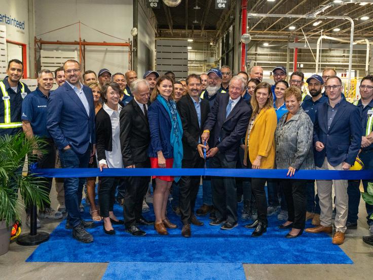 A group of Saint-Gobain and Hydro-Quebec employees celebrate the expansion of the Montreal plant.