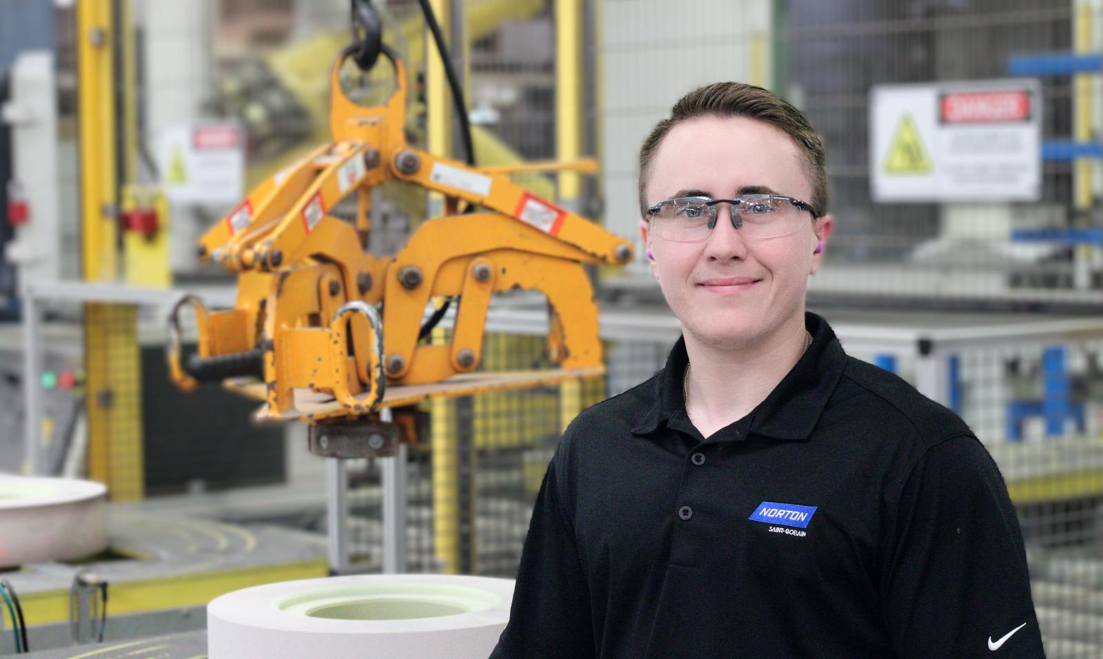 A picture of an employee holding reputable engineering and manufacturing jobs at Saint-Gobain.