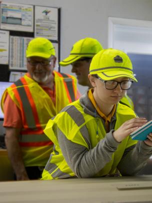 Female engineer works in quality lab for engineering development program at Saint-Gobain, Essentials of Manufacturing
